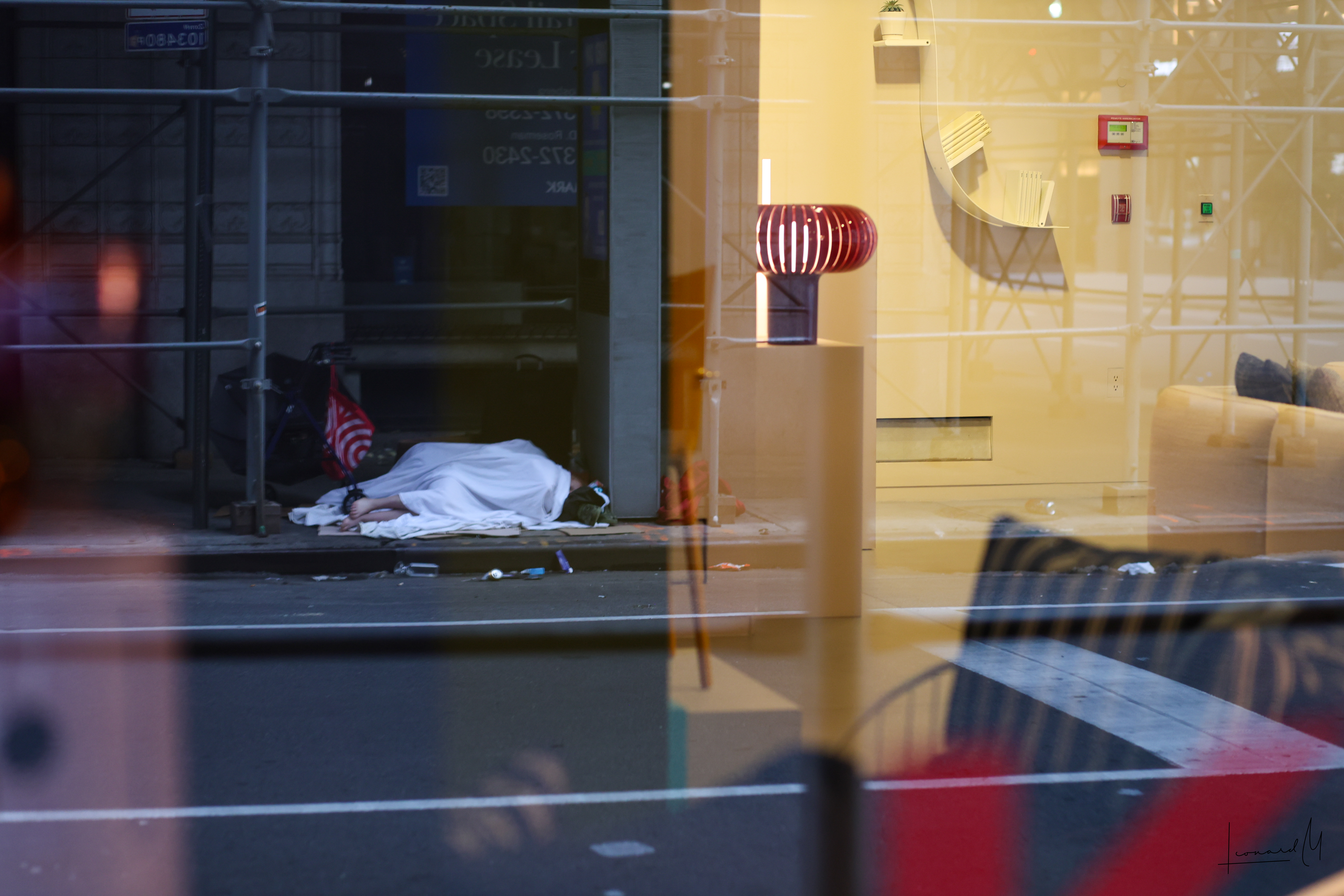 Homeless outside of designer funature store